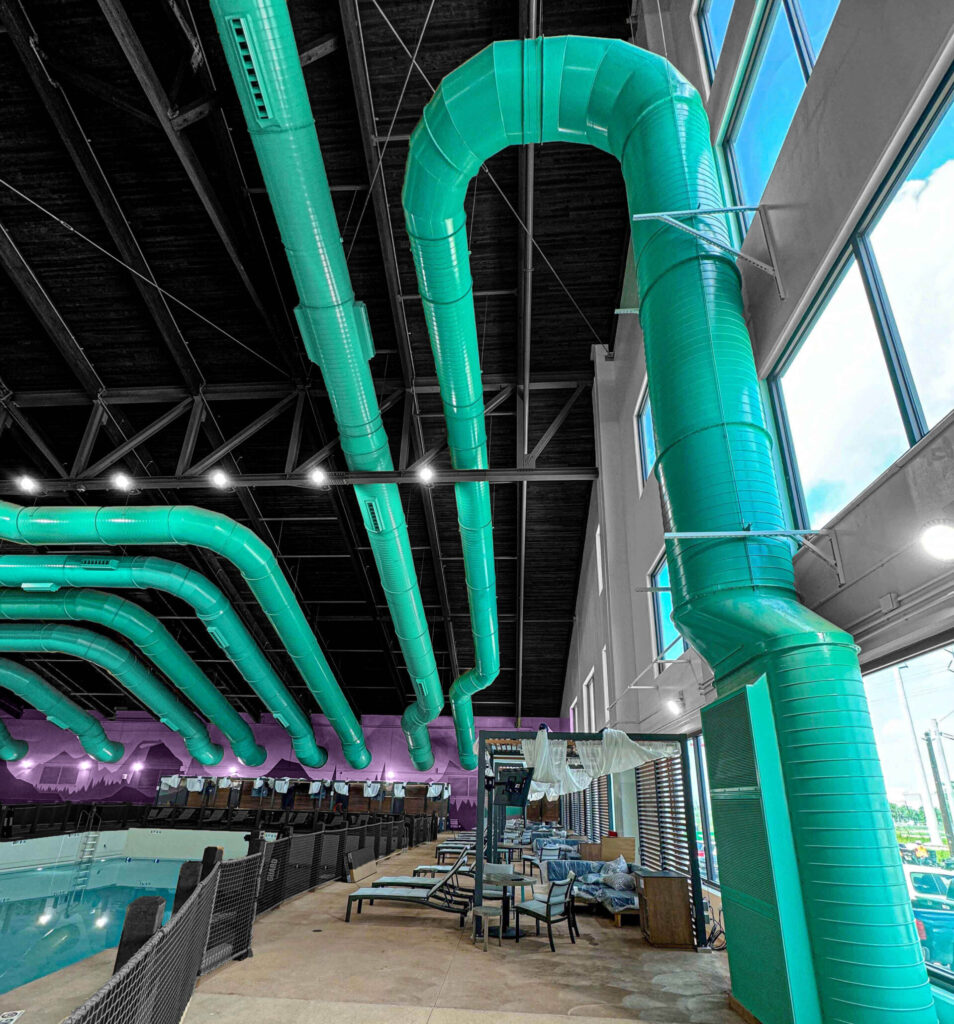 Large-scale anticorrosion ductwork installed at a resort aquatic center, designed to withstand high humidity and chlorinated air